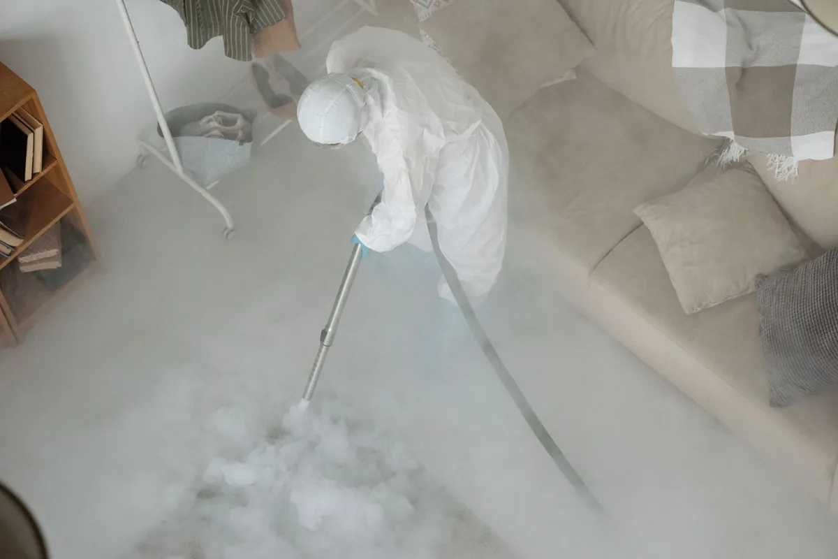 Biohazard cleanup technician in protective equipment, Joffre, Memphis, TN